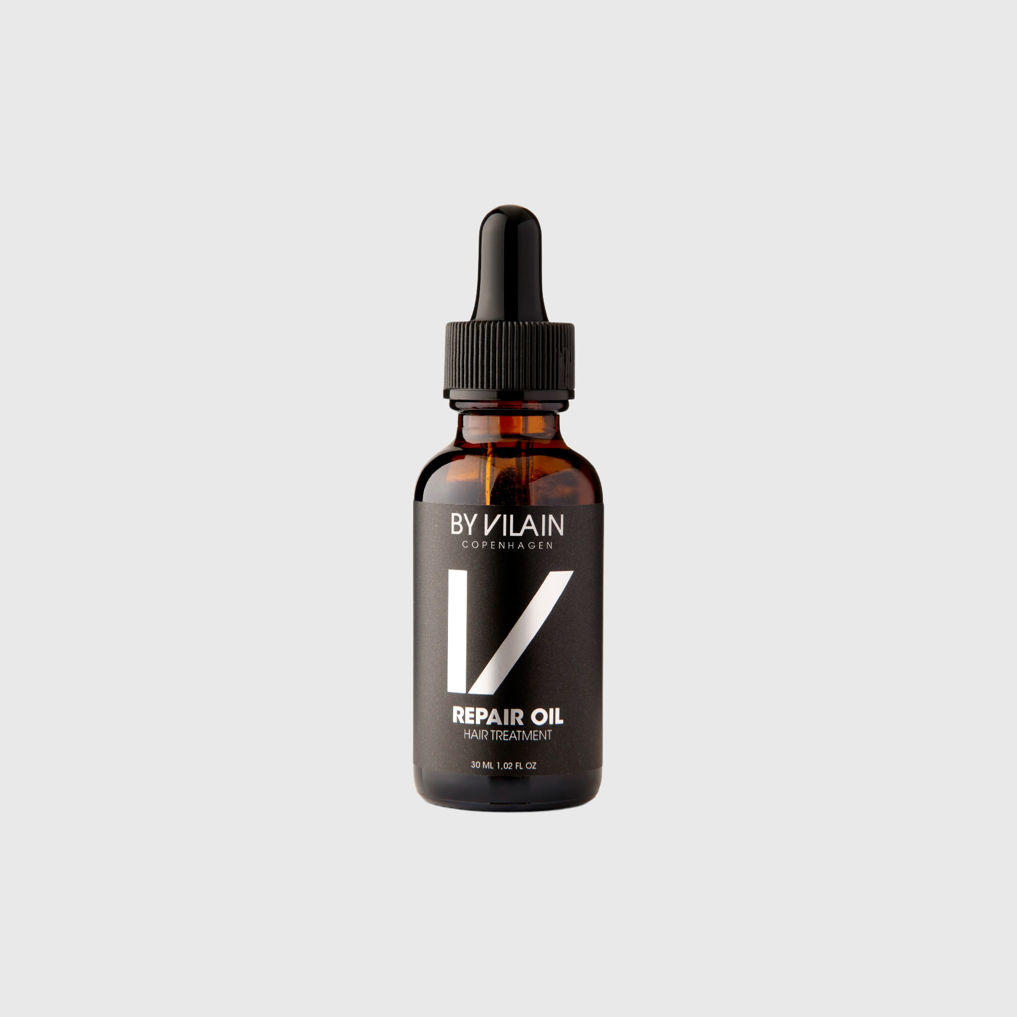 By Vilain Repair Oil - Argan Hair Treatment in amber glass dropper bottle. Ideal for nourishing dry hair, reducing split ends, and adding shine.