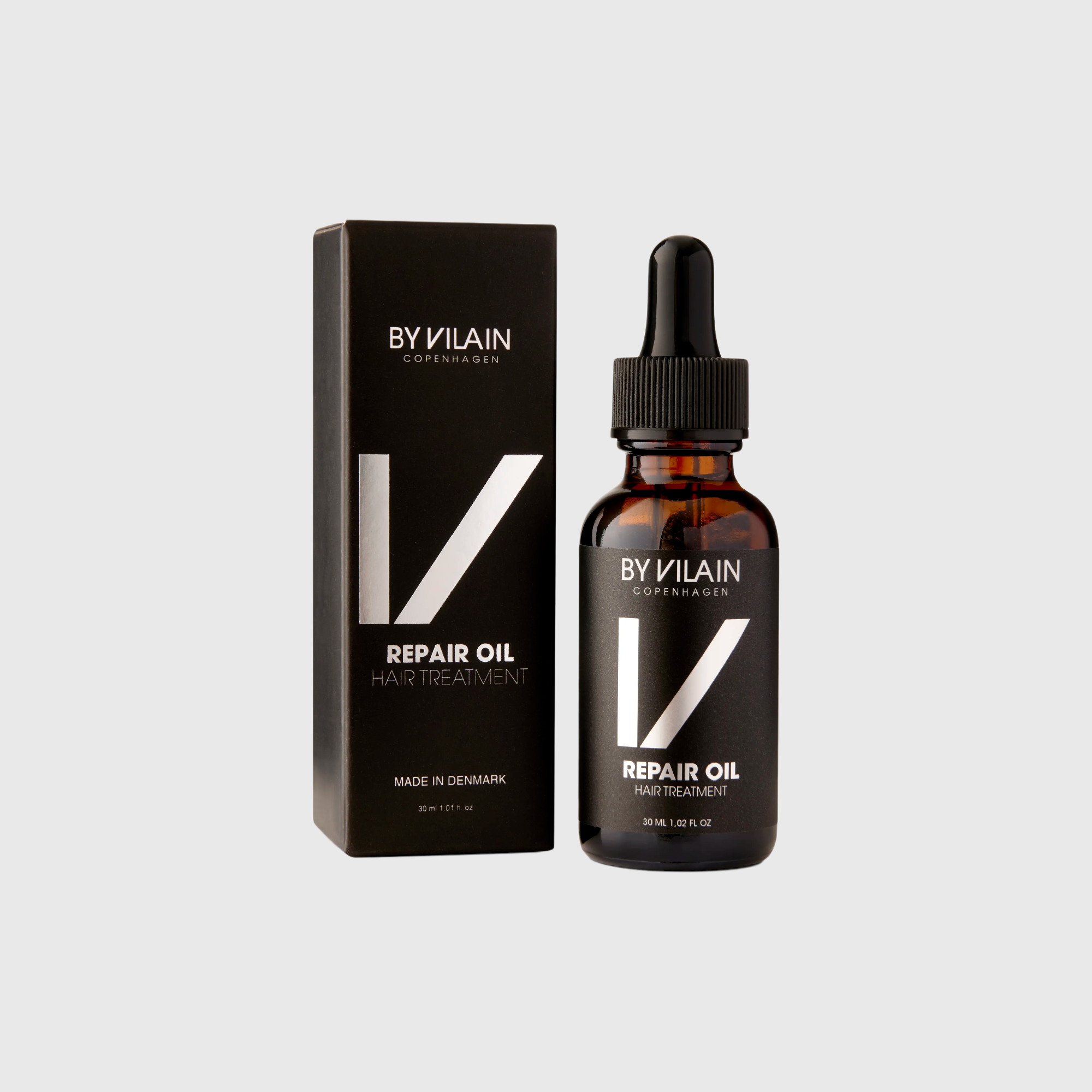By Vilain Repair Oil - Argan Hair Treatment in amber dropper bottle with matching black box. Ideal for nourishing dry hair and reducing split ends.