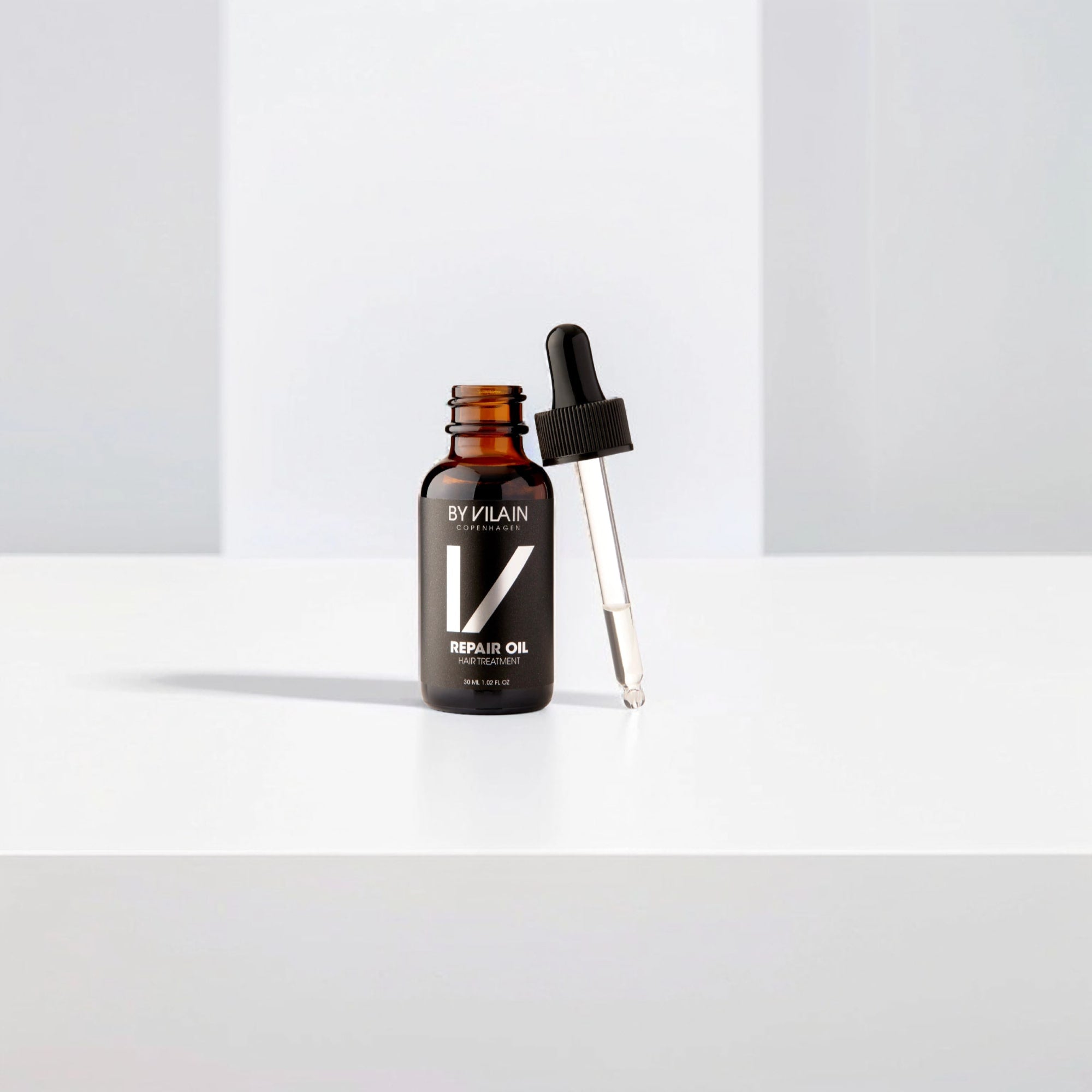 By Vilain Repair Oil - Argan Hair Treatment in a sleek amber bottle with dropper, ideal for nourishing dry hair and reducing split ends.